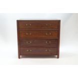A 20th century Chinese hardwood chest of four drawers with brass handles,