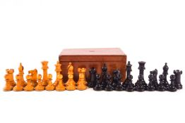 A turned ebonised and natural wood chess set,