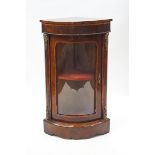 A Victorian walnut and crossbanded bow front standing corner cabinet with gilt metal mounts,