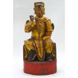 A Chinese carved painted and gilded figure of a temple guardian,