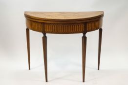 An 18th century kingwood demi-lune games table,
