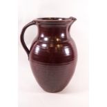 A Studio pottery jug by John Leech with brown concentric circle glaze, impressed JL monogram,
