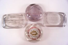 Four Edwardian glass advertising paperweights: The Kennicott Water Softener Co,