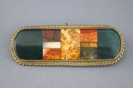 A Scottish agate bar brooch set within a gold plated rope edge mount. Pin and hook fitting. 22.