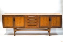 A G-Plan teak sideboard, with four central drawers flanked by cupboards,