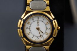 An Yves Saint Laurent ladies stainless steel and gilt bracelet watch, circa 1988,