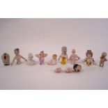 A collection of early 20th century porcelain half dolls and bisque doll heads
