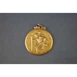 A hallmarked 9ct gold Saint Christopher pendant. 4.