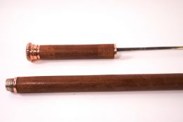 An early 20th century sword stick with copper mounts