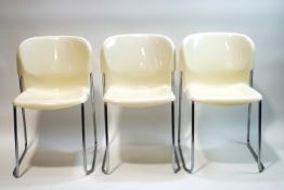 A set of three 1980s Gerd Lange plastic stacking chairs on chromed metal legs
