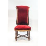 A Victorian mahogany nursing chair, the turned and block legs joined by an H-stretcher,
