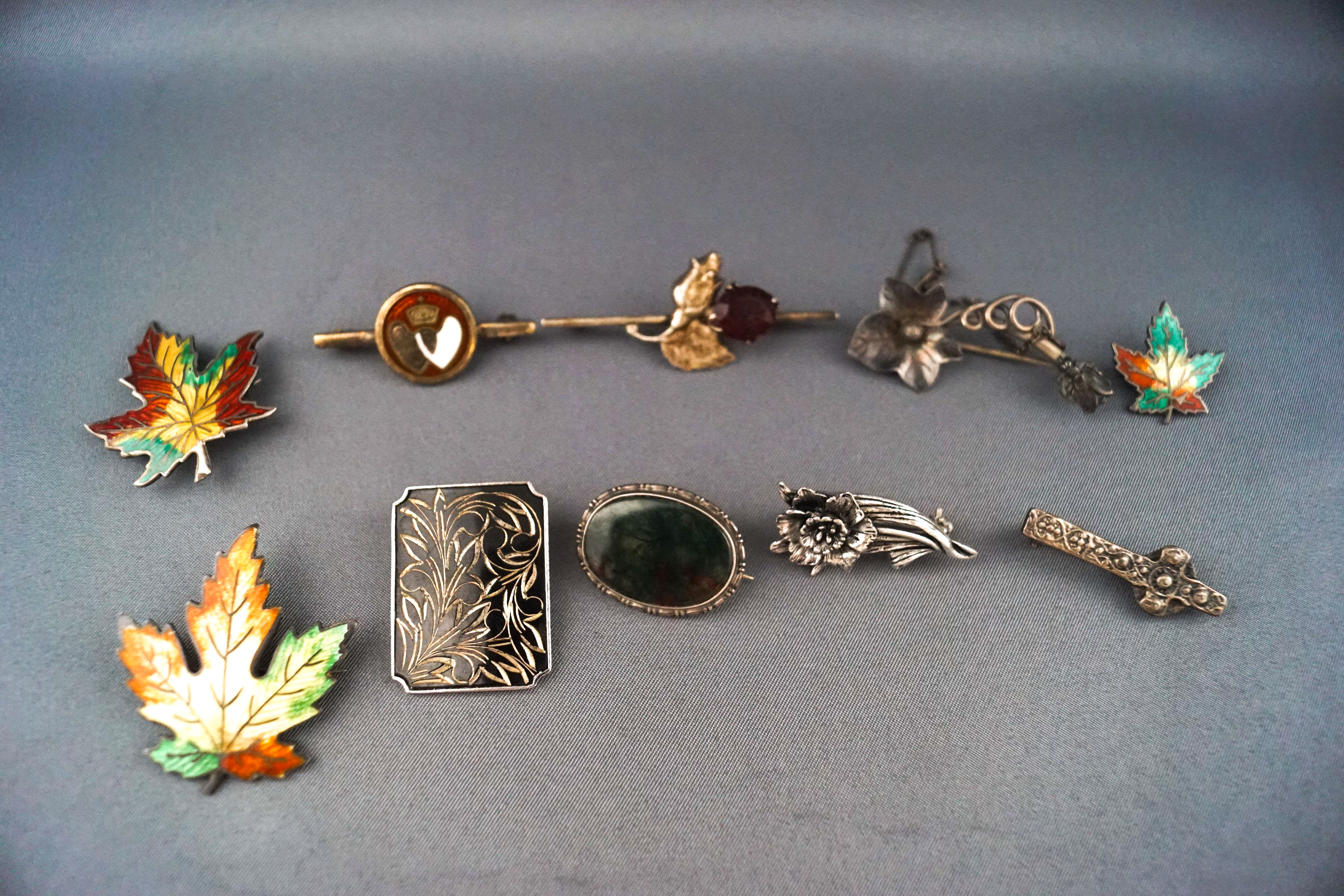 A selection of ten silver brooches consisting of three variable sized enamelled leaves, - Image 2 of 2