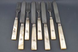 A set of eight Victorian silver bladed and mother of pearl handled fruit knives and forks,