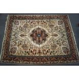 A Persian style machine woven rug,