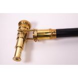 An ebonised walking stick with brass 'telescope' handle, the end stamped 'Ross,