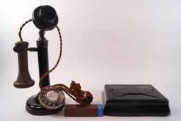 An early 20th century lacquered 150 candlestick telephone (unmodified) and a Bell set 25