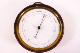 A 19th century brass aneroid barometer with hanging loop, no maker's name, 12.