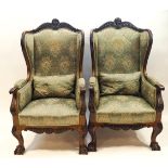 A pair of 19th century mahogany wing back armchairs,