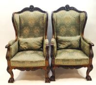 A pair of 19th century mahogany wing back armchairs,