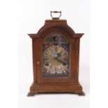 An early 20th century oak cased bracket clock with moon phase dial, eight day movement,