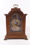 An early 20th century oak cased bracket clock with moon phase dial, eight day movement,
