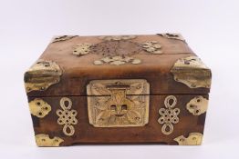 A Chinese jewellery box with decorative brass mounts and side handles, 12cm high x 23cm wide x 16.