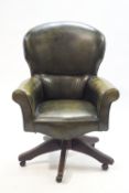 An early-mid 20th century green leatherette swivel office chair