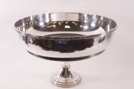 A large modern silver plated bowl with reeded and cross detail to outer rim,