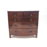 A George III mahogany bow fronted chest of two over three drawers,