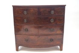 A George III mahogany bow fronted chest of two over three drawers,