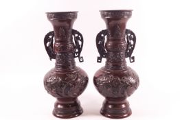 A pair of early 20th century Japanese bronze vases of Archaic form,