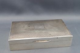 A silver cigarette box with engine turned decoration to cover, Birmingham 1969, 14.