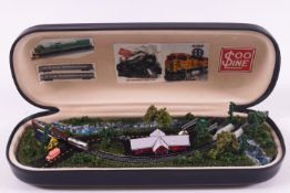 A 'Tiny Trains' glasses case model of a train with pull 'mechanism', 1:900 scale, 15.