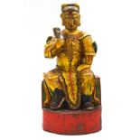 A Chinese carved painted and gilded figure of a temple guardian,