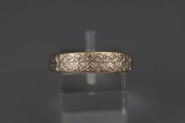 A white metal half hoop ring set with single cut diamonds. Hallmarked 18ct gold, London, 1970.