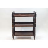 A late Victorian mahogany three tier buffet on turned supports and ceramic casters,