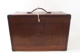 A mahogany M & W Engineering cabinet the locked front opening to reveal four short drawers and