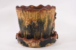 A Donyatt pottery planter with green and yellow textured bark effect, 17cm high and a matching dish,