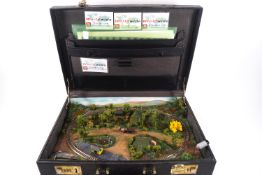 A Birke-Geholtz miniature model train shunting layout within a briefcase,
