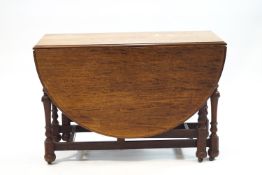 A Victorian mahogany drop leaf gateleg table with drawer to one end,