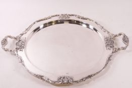 A modern silver plated two handled tray, made in Lebanon, cast with Classical motif decoration,