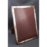 A rectangular white metal photograph frame, marked 'Made in Hong Kong, Sterling',