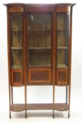 An Edwardian inlaid mahogany bow fronted display cabinet,