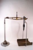A pair of painted cast brass butchers scales, no weights,