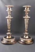 A pair of Sheffield plate candlesticks, with gadrooned rims, 28.