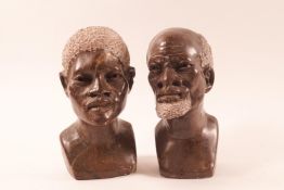 A pair of African carved hardstone busts of a man and woman,