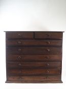 An oak and pine collectors chest of two short and six long drawers with turned handles, 60cm high,