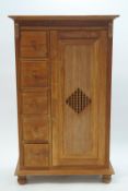 A modern teak standing cupboard with four shelves and five drawers to the side,