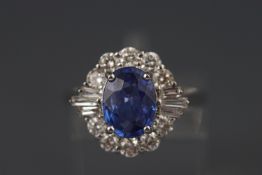 A white metal sapphire and diamond cluster ring. Sapphire approx 2.00cts Diamonds approx 0.75ct.