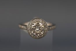 A white metal diamond halo cluster ring.